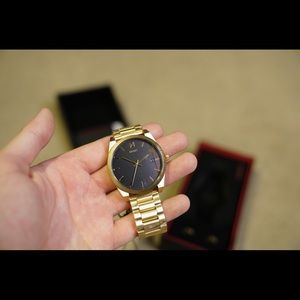Gold and black MVMT watch